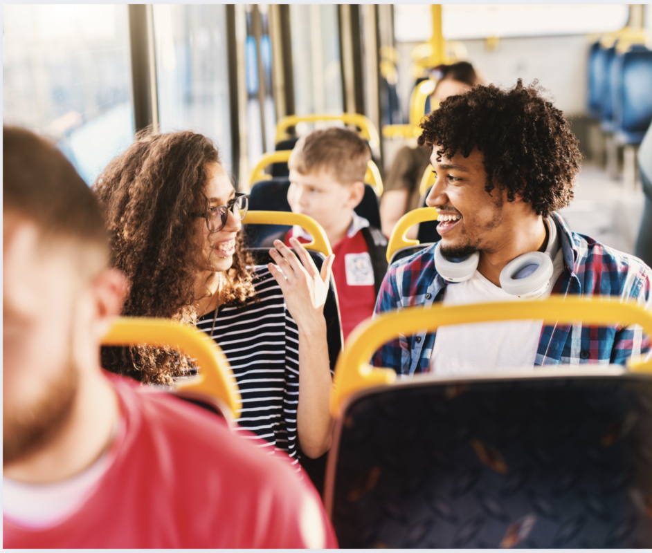 a group of people are sitting on a bus